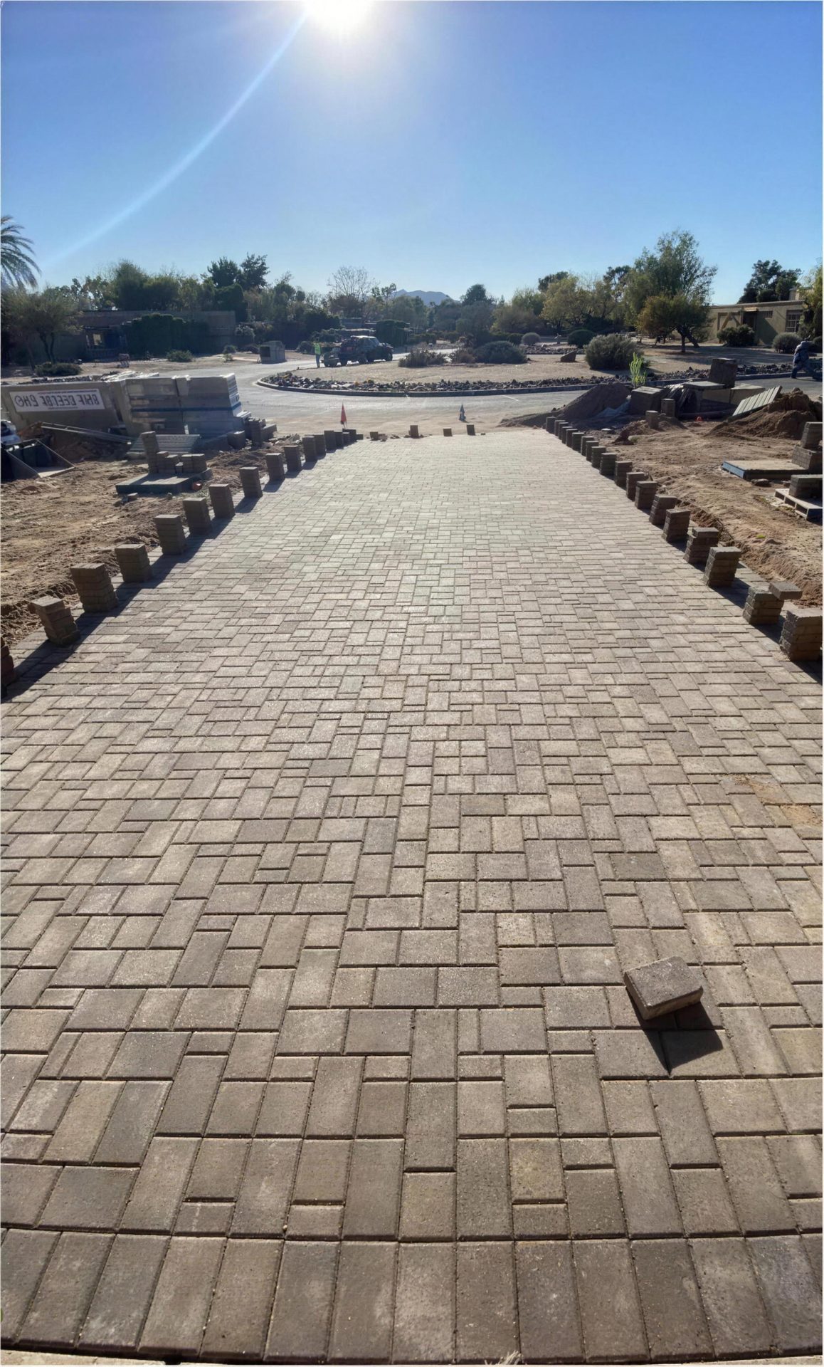 After: wide paver path laid to the street, border bricks going in