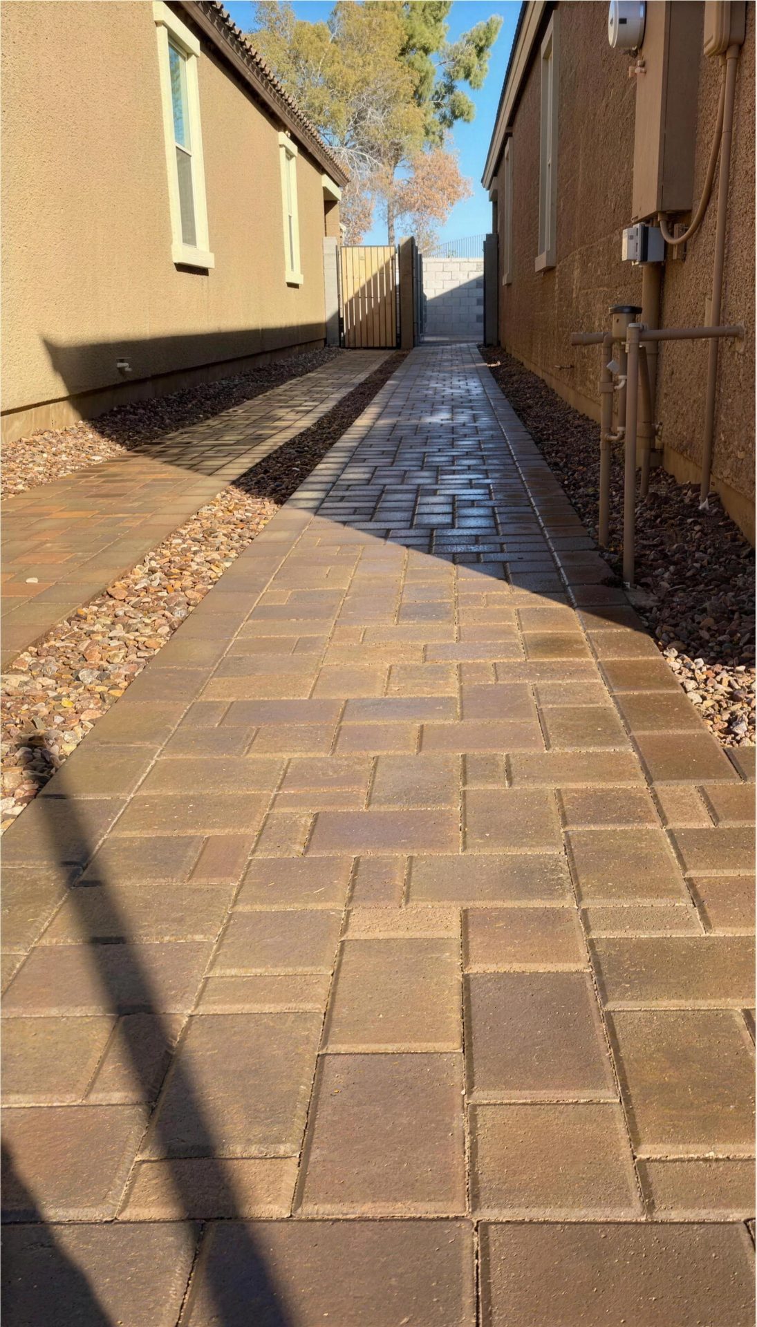 After: paver walkway with gravel borders running to the back gate