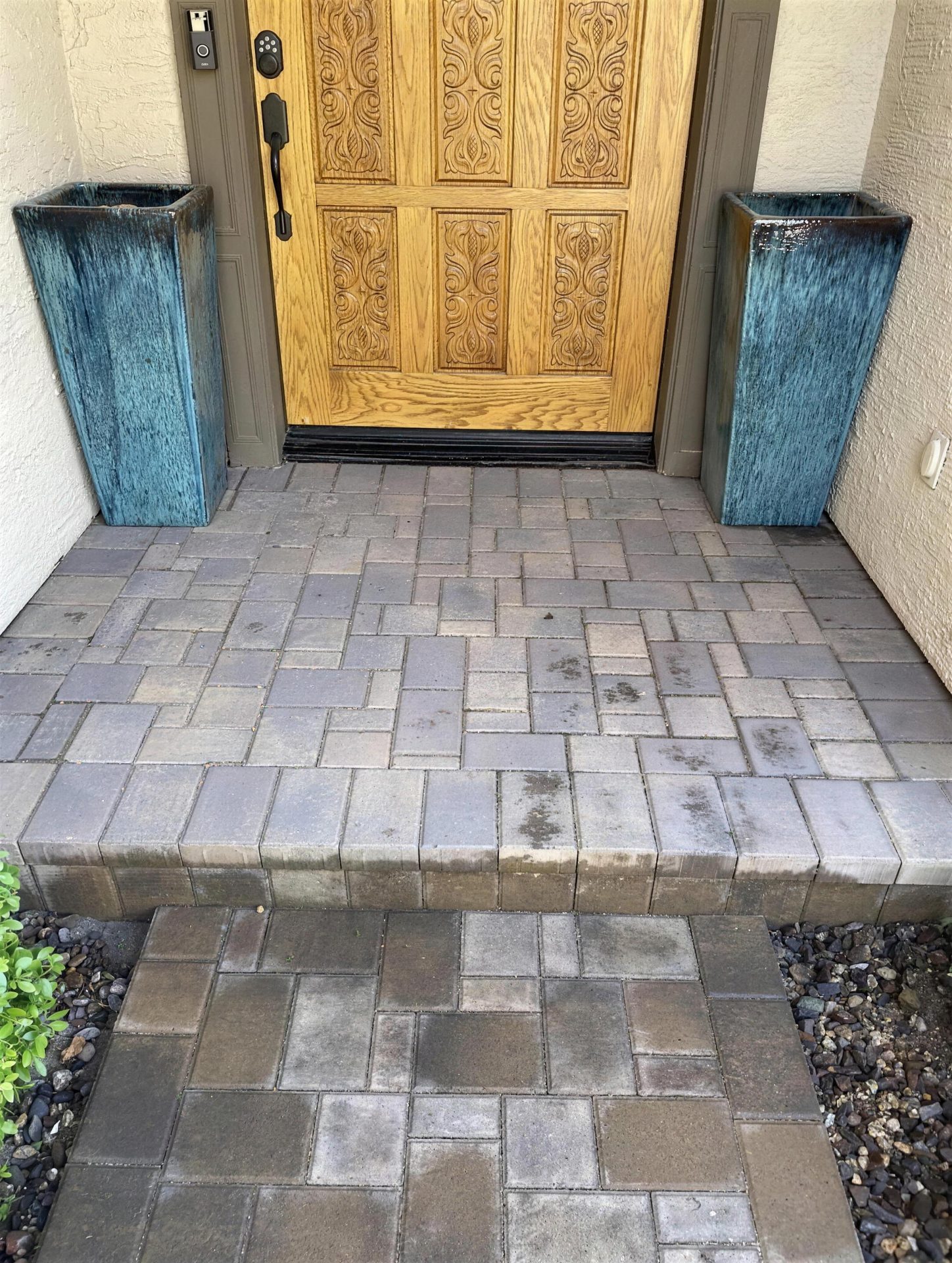 Paver entry walkway and step at a front door