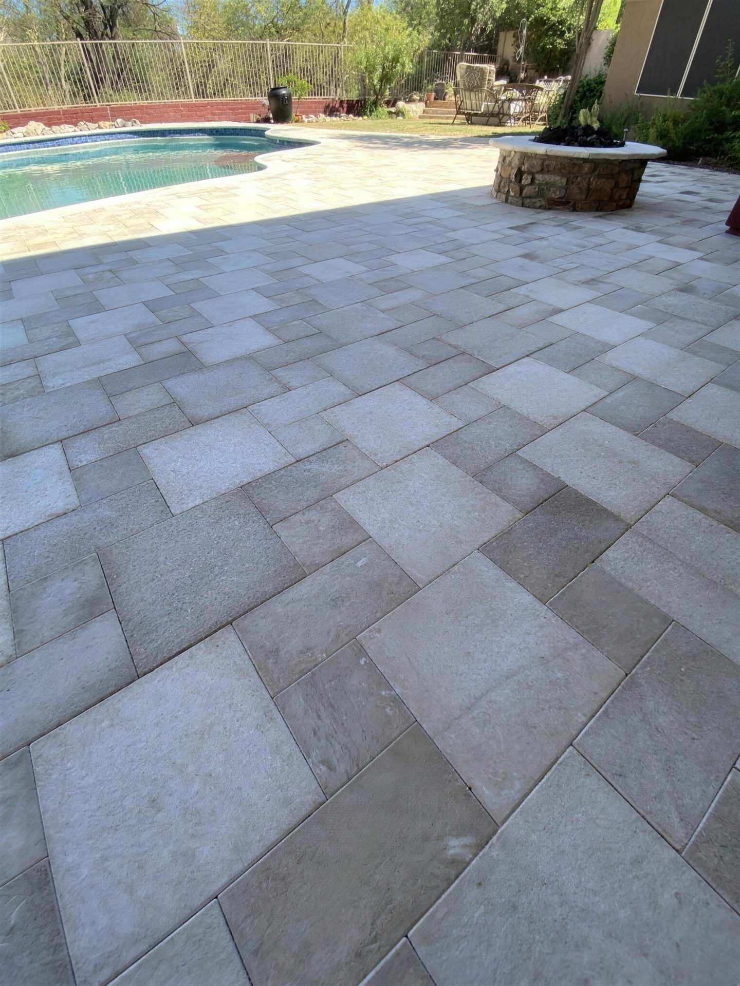 Paver patio surface up close at the fire pit and pool edge